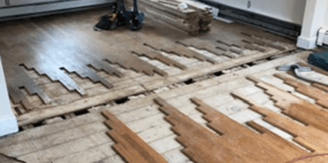 Repairing a damaged hardwood floor.