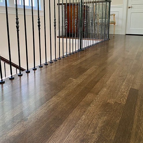 Hallway with dark floor stain in Wellesley, Massachusetts.