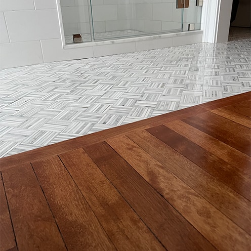 Beacon Hill harwood floor next to marble.