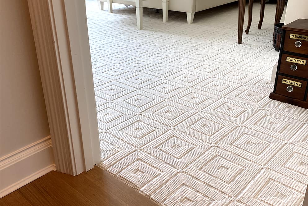 White, luxury carpet installed in a large bedroom.